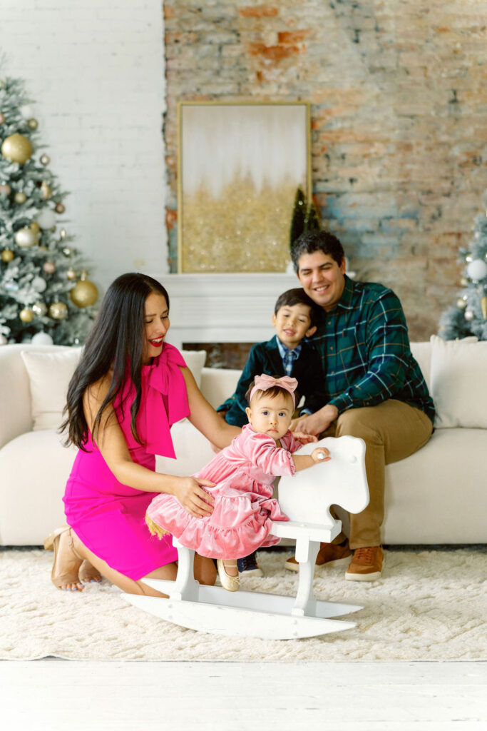Christmas family photo session in Buford GA - family posing in studio
