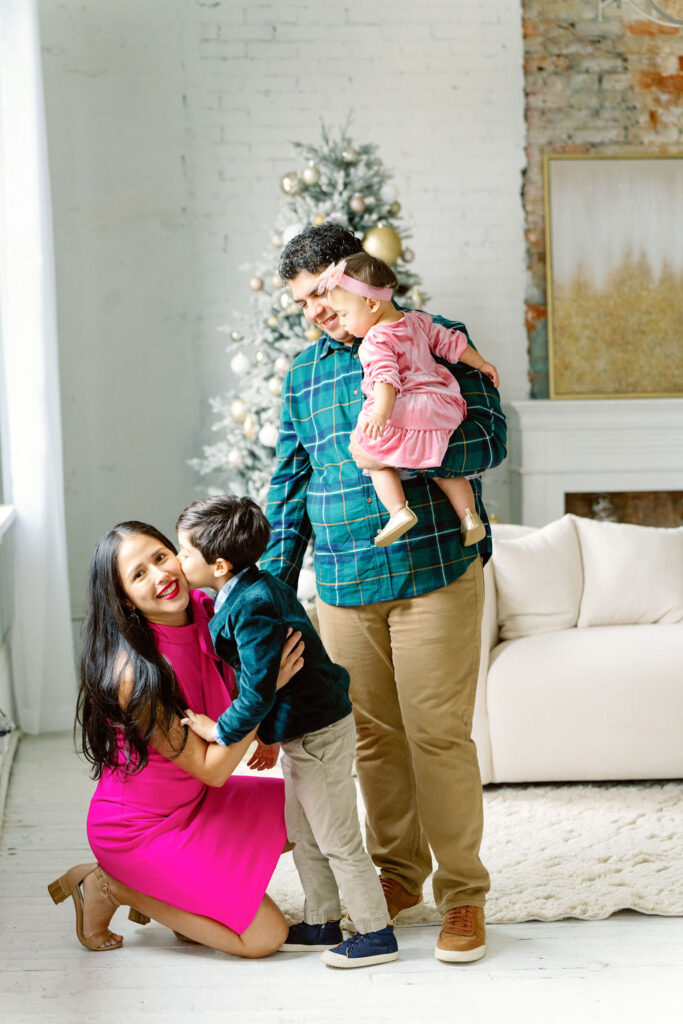 Christmas family photo session in Buford GA - family posing in studio
