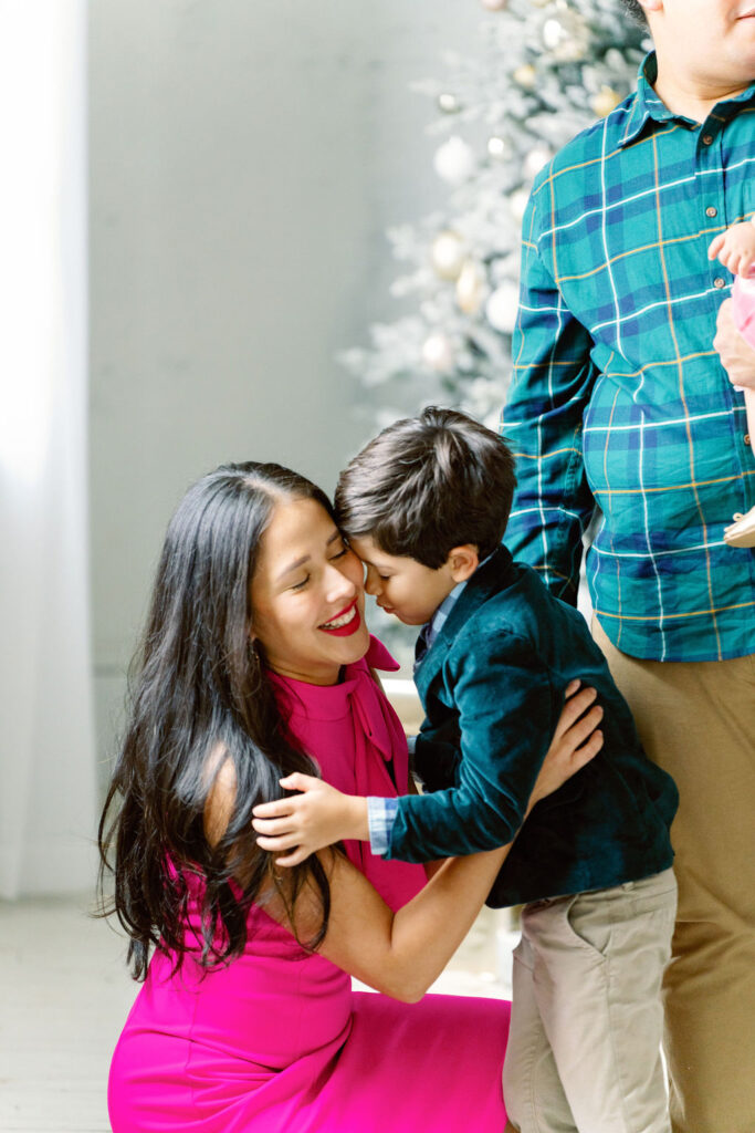 Christmas family photo session in Buford GA - family posing in studio
