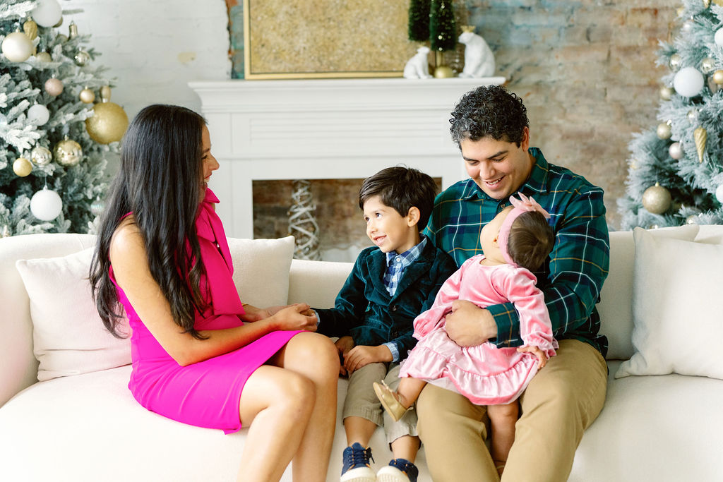 Christmas family photo session in Buford GA - family posing in studio
