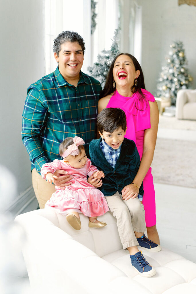 Christmas family photo session in Buford GA - family posing in studio

