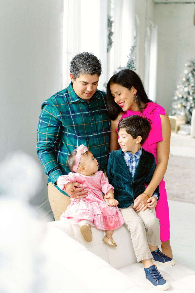 Christmas family photo session in Buford GA - family posing in studio
