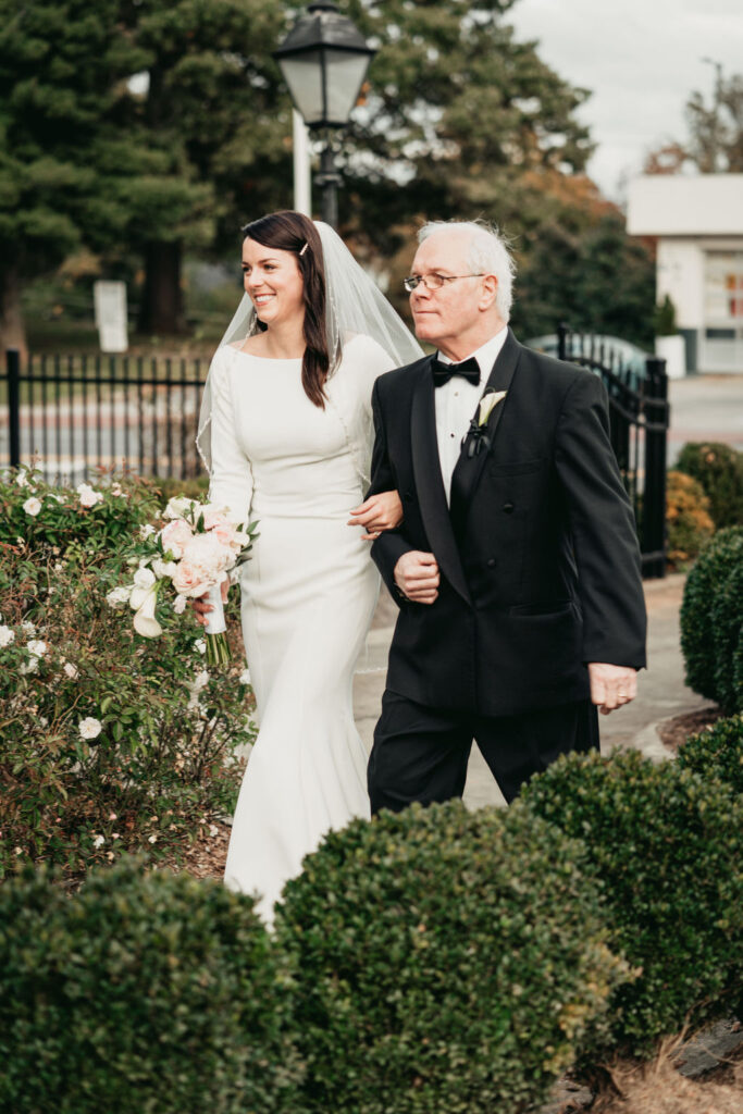 Romantic wedding at Rhodes Hall - bride and groom embracing on the staircase

