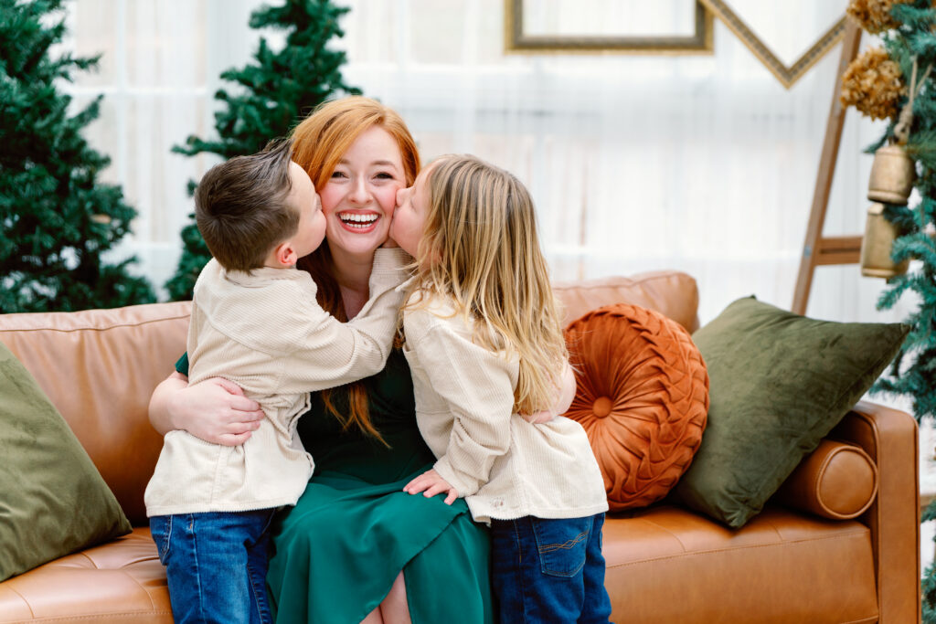 Family Christmas Mini Sessions Lawrenceville GA greenhouse setup with garland and sofa