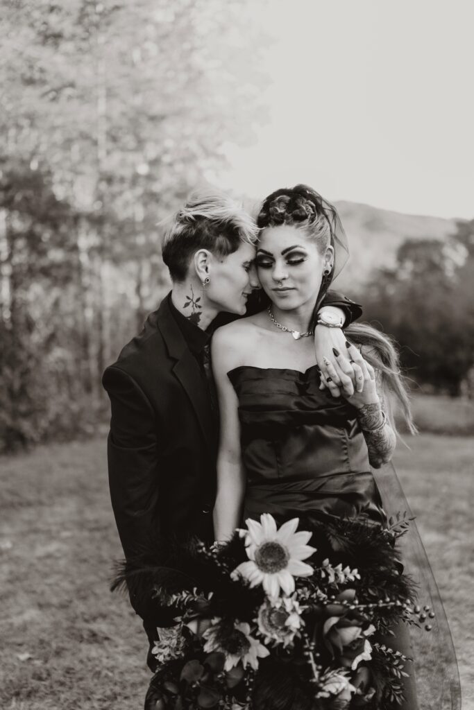 Moody fall bouquet with deep florals and candles | LGBTQ+ wedding inspiration Georgia