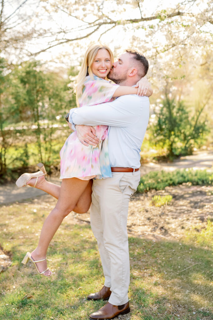 Couple celebrating their engagement with their dog