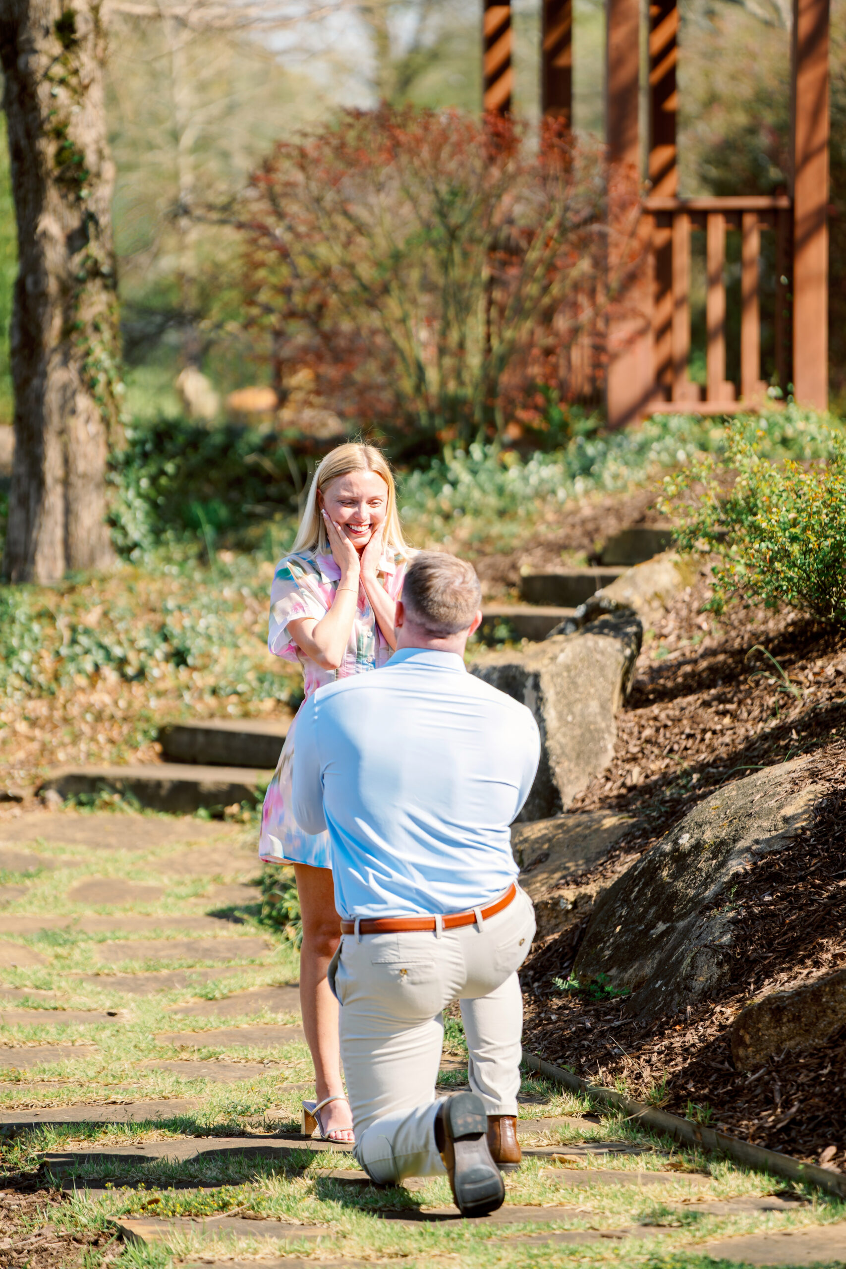 Couple celebrating their engagement with their dog