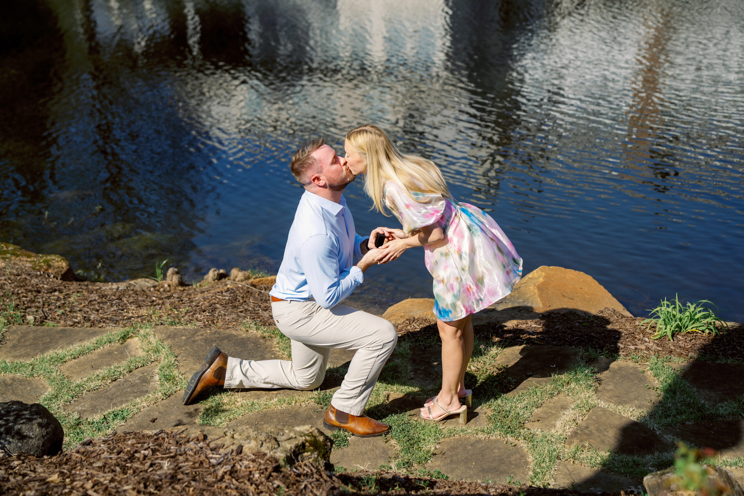 Couple celebrating their engagement with their dog