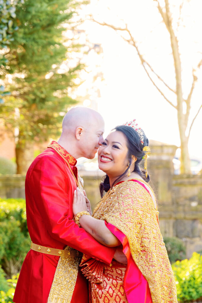 A beautiful Cambodian wedding in Atlanta featuring traditional gold attire and cherry blossom backdrops