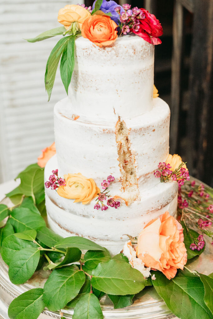 Cake cutting during intimate Glen-Ella Springs wedding reception

